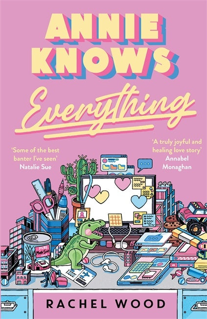 Book cover of 'Annie Knows Everything' with a vibrant illustration of a desk full of toys and activities 