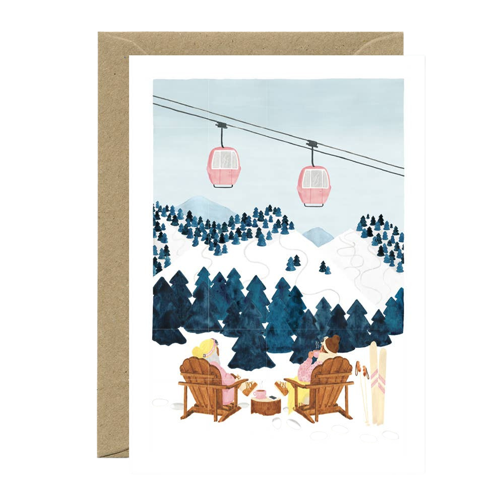 Greeting card with illustration of two people in Adirondack chairs by a snowy mountain landscape with gondolas.