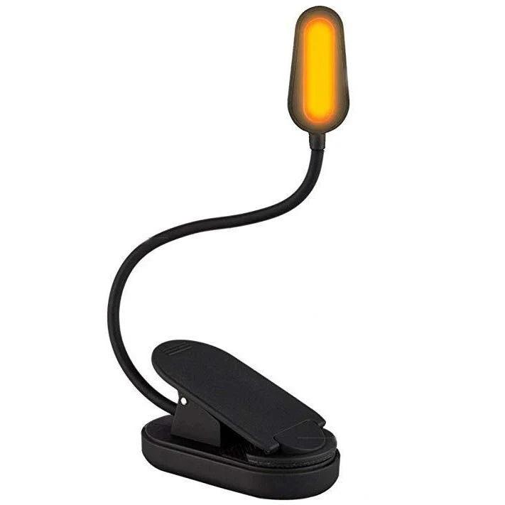 Black book light with flexible arm and orange LED on a white background