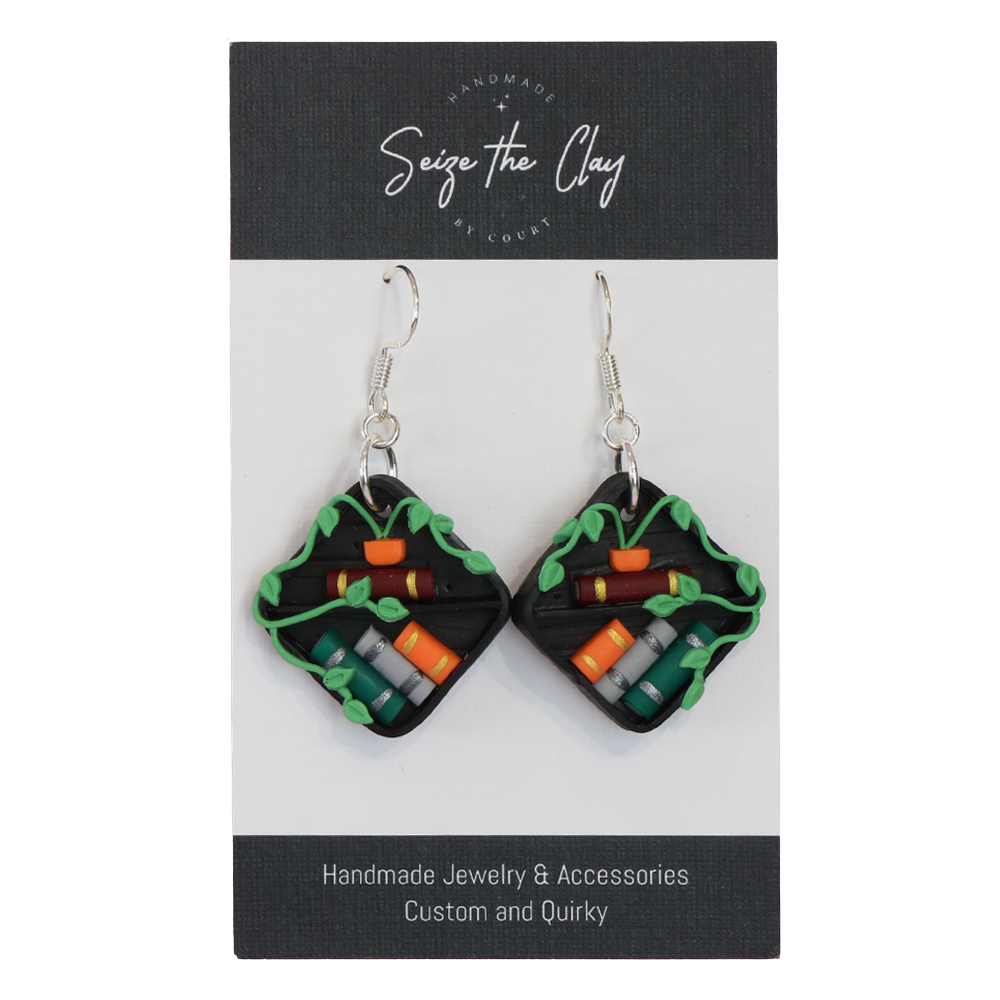 Pair of handmade earrings on a 'Seize the Clay' branded card.