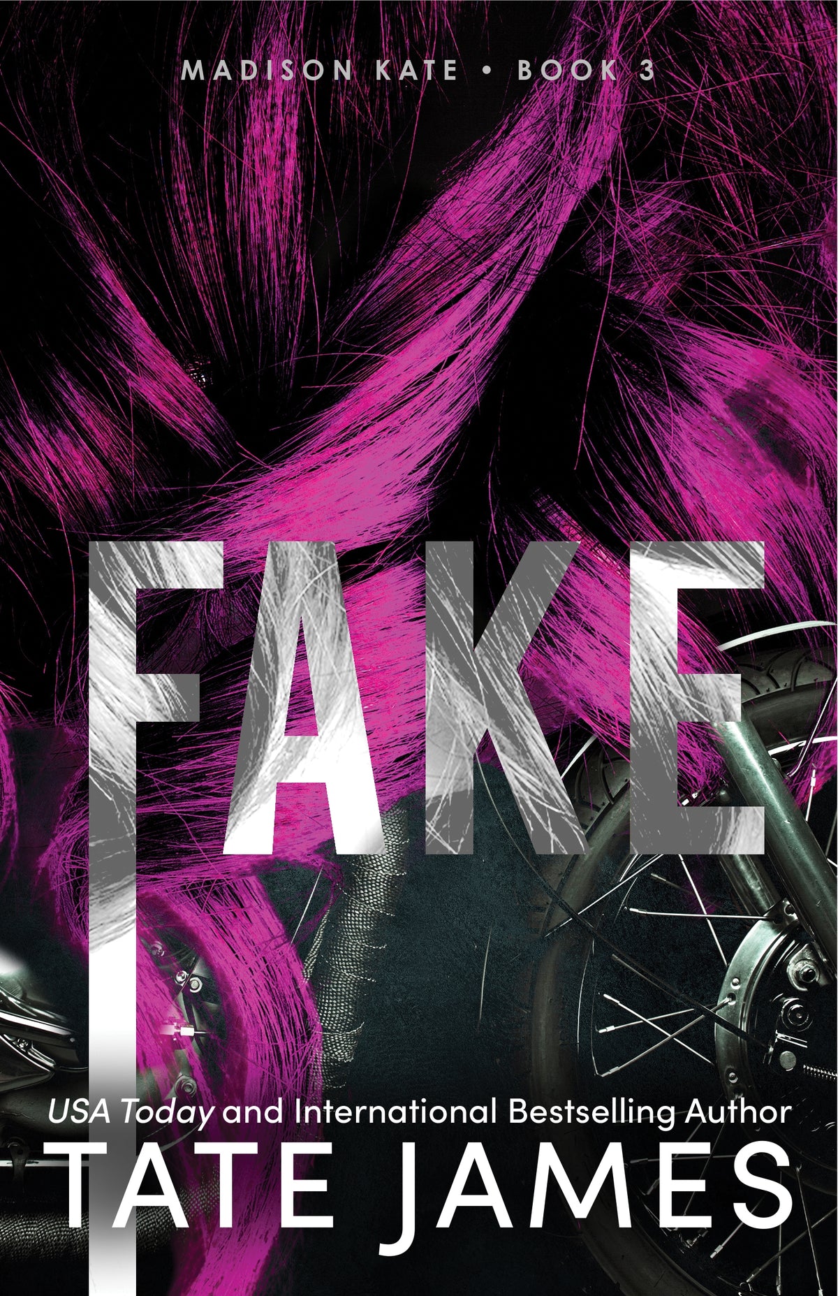 This image features the cover of "Fake," which is the third book in the Madison Kate series by Tate James. The bold cover is designed showcasing a close-up of a woman's face with vibrant pink hair, overlaid with the title "FAKE" in large, metallic letters with a motorbike in the background. 