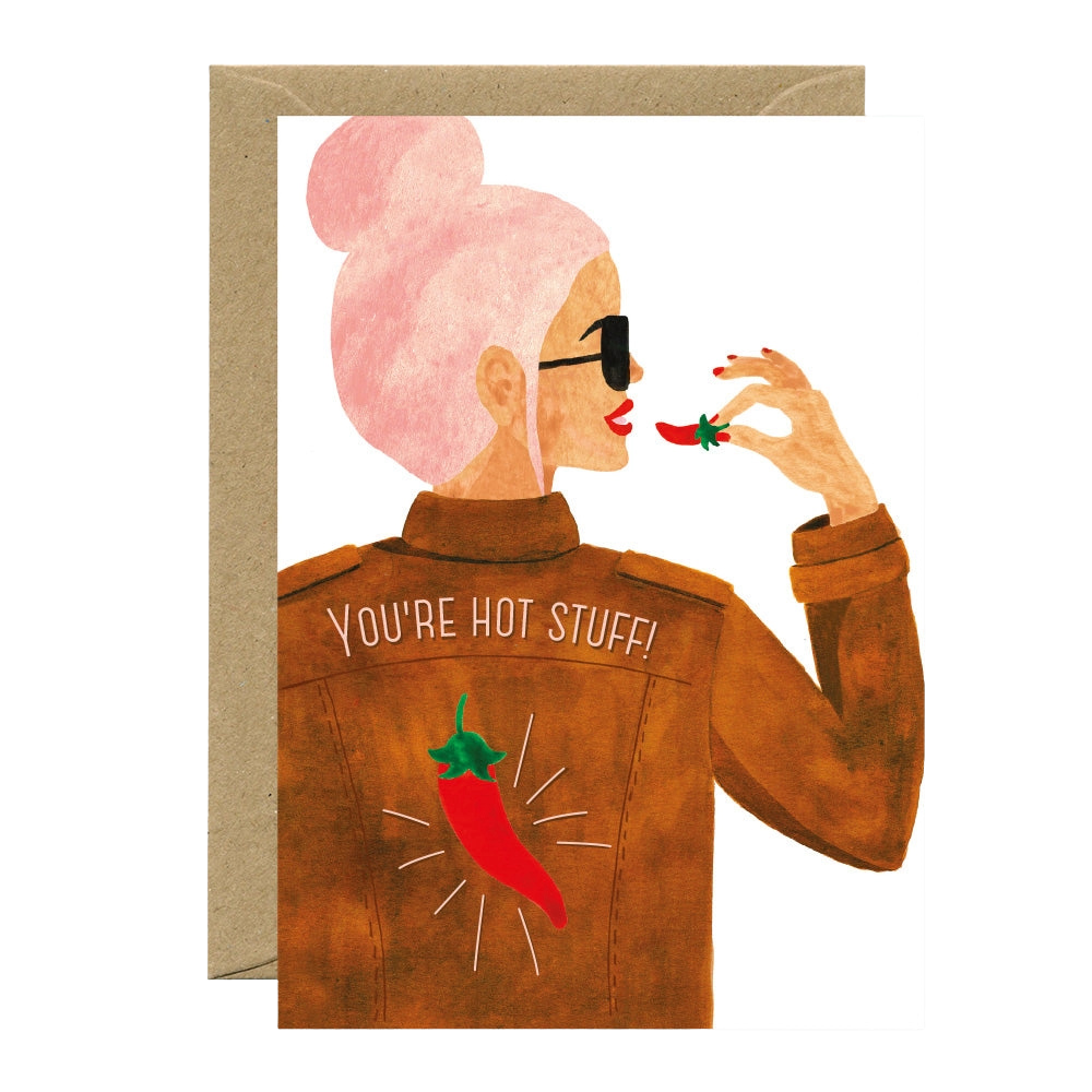 Illustration of a person wearing a jacket with &#39;You&#39;re Hot Stuff!&#39; text and a red chili pepper design, holding a red chili pepper.