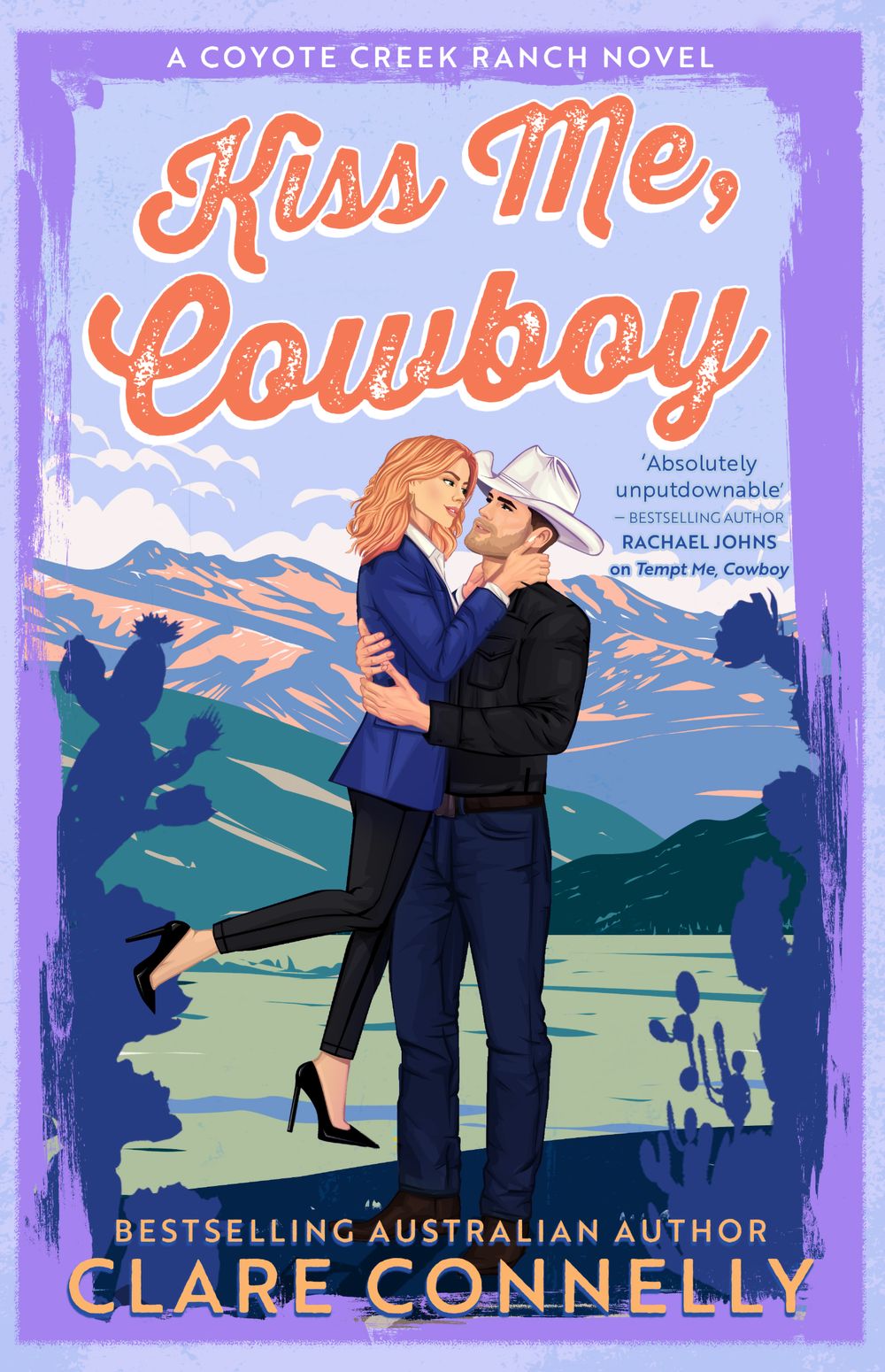 Book cover of 'Kiss Me, Cowboy' featuring a couple embracing with a desert landscape in the background