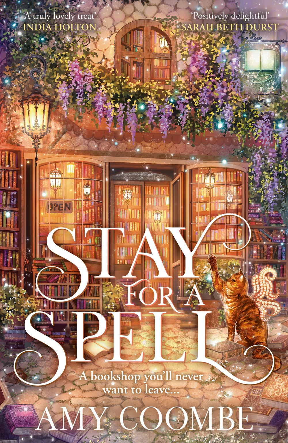 Book cover of 'Stay for a Spell' with a cozy bookshop and an orange cat out the front 