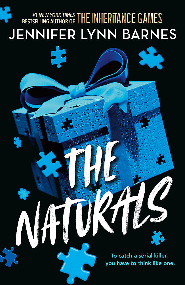 Book cover of 'The Naturals' featuring a blue gift box with a ribbon and puzzle pieces 