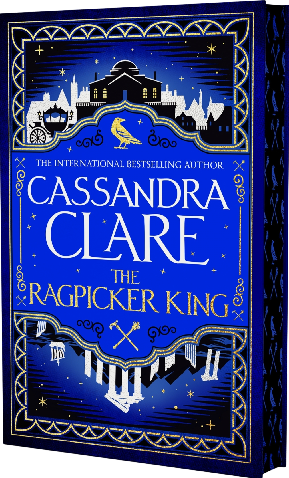 Book cover of &#39;The Ragpicker King&#39; by Cassandra Clare with decorative elements and blue background