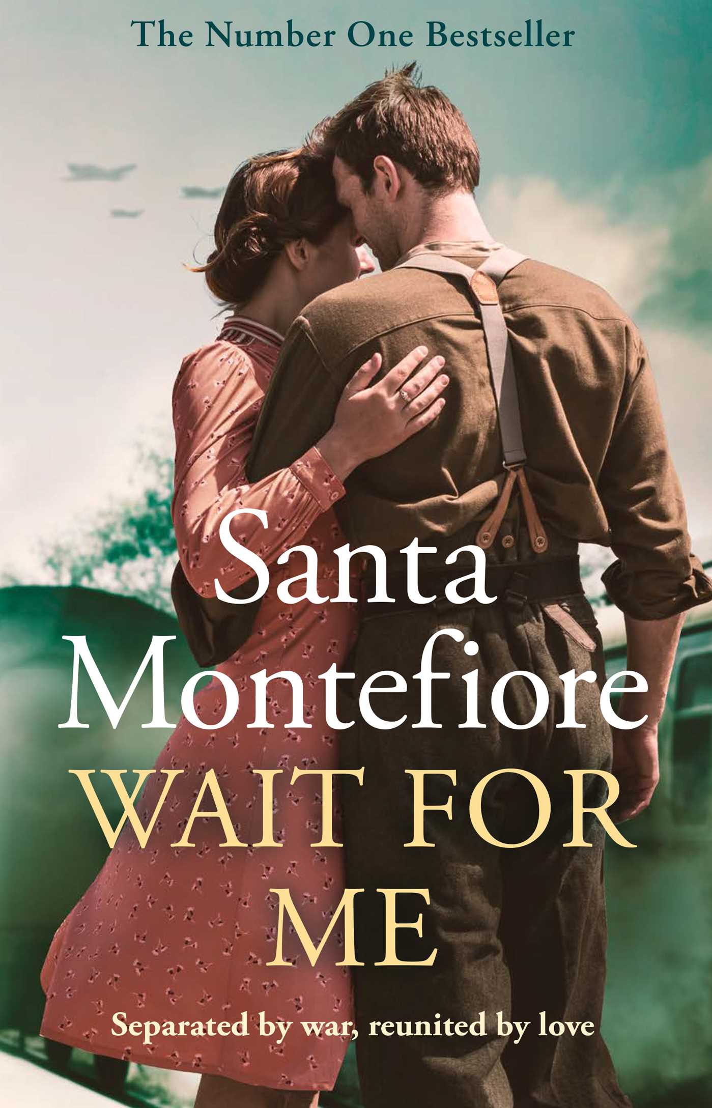 The cover of the book 'Wait for Me' by Santa Montefiore features an image of a couple embracing, with the man holding the woman close as they stand in front of a body of water and a sky with clouds.